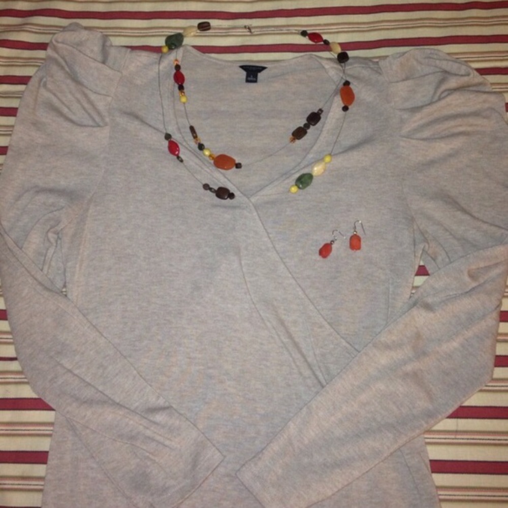 Beige puddle sleeve wrap style blouse